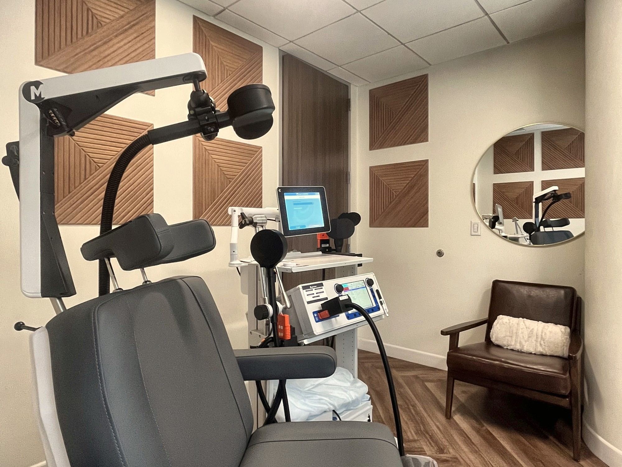 The private TMS room with seating for a friend or family member.