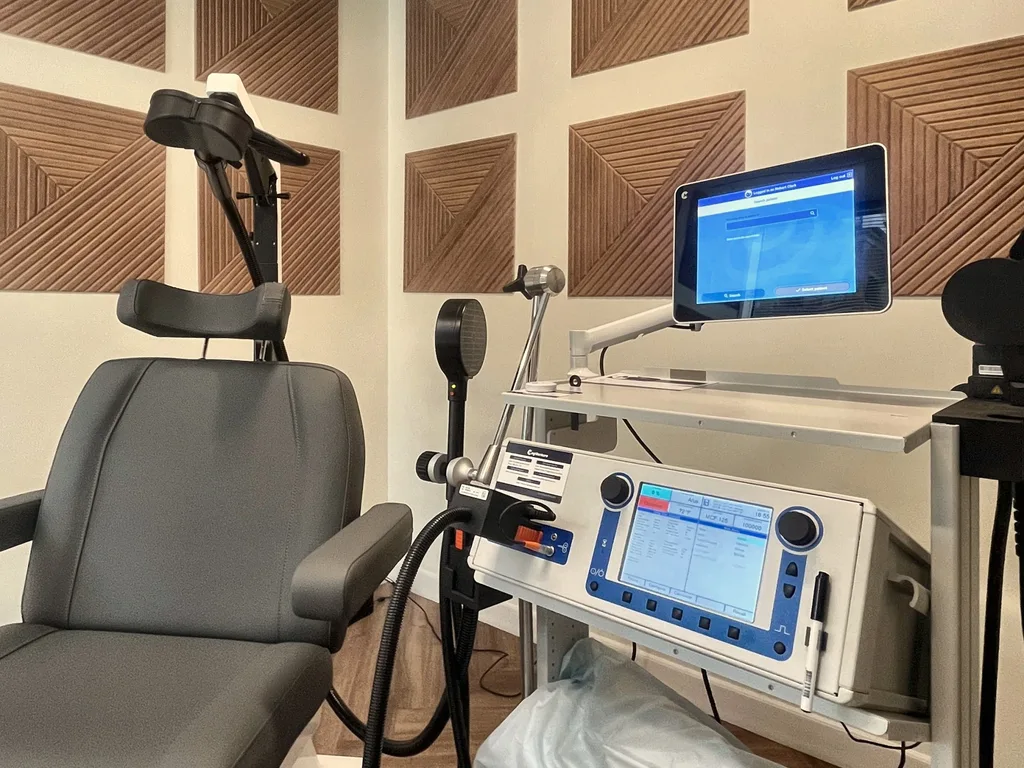 The TMS treatment chair and stimulator in our private Dallas treatment room.